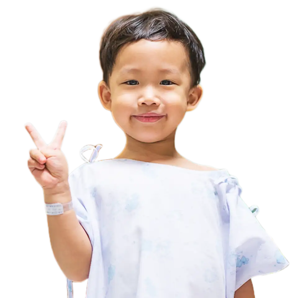Smiling Child in Hospital Gown | Prestige Health Partners Smiling child in light-blue hospital gown showing peace sign, wristband, Prestige Health Partners pediatric healthcare