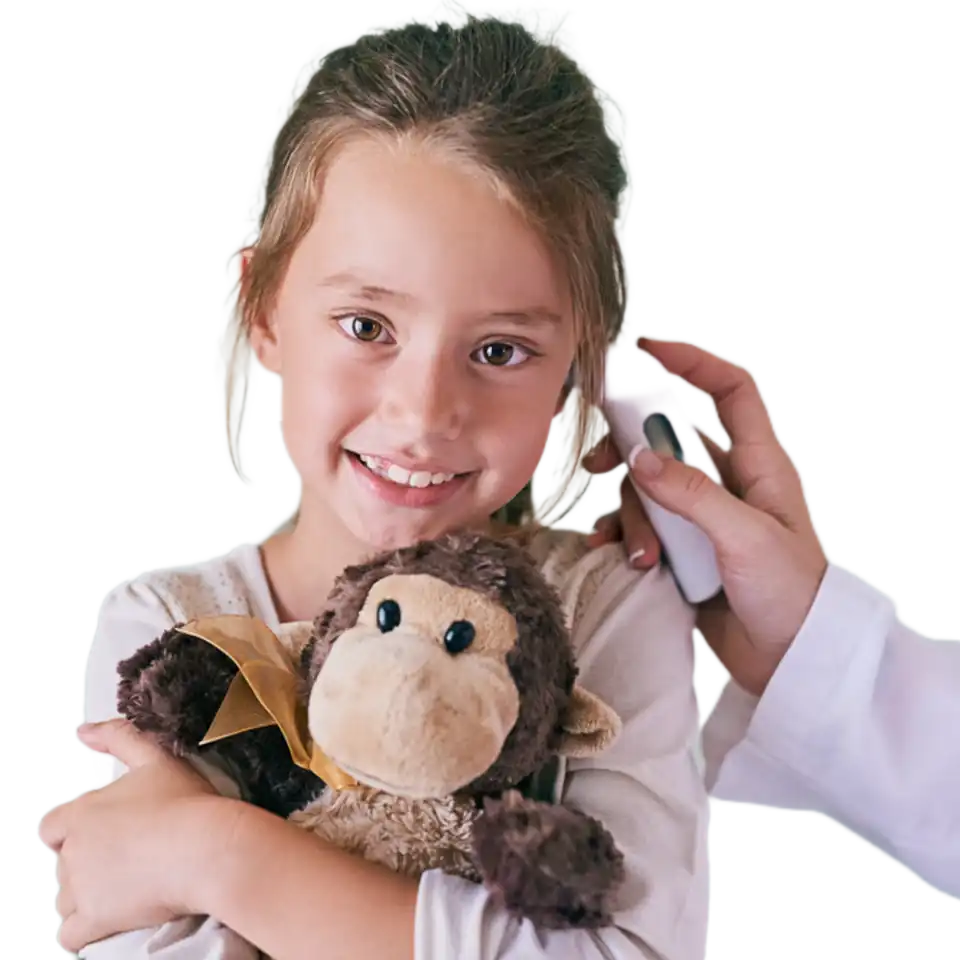 Pediatric Ear Thermometer Check | Prestige Health Partners Smiling child hugging brown stuffed monkey during ear thermometer check by clinician—Prestige Health Partners pediatric exam