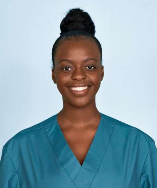 happy-young-female-african-scrub-nurse-wear-blue-uniform-isolated-on-background--1024x682