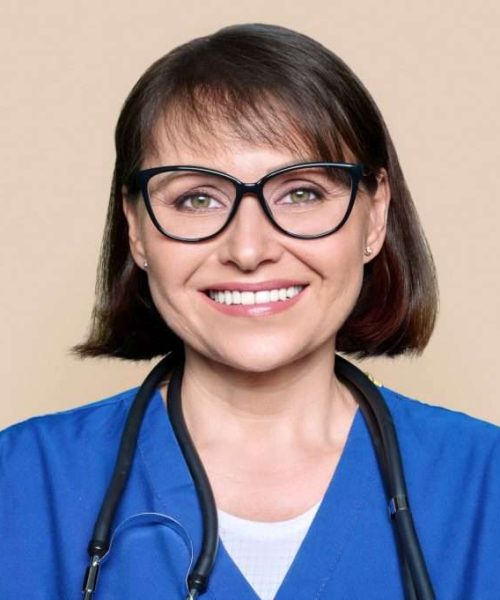 middle-aged-female-nurse-in-blue-uniform-with-stethoscope-smiling-looking-at-camera-1024x682