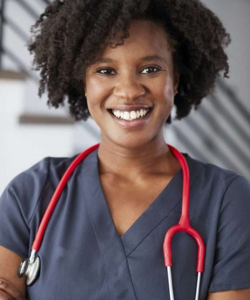 portrait-of-female-nurse-wearing-scrubs-in-hospital-682x1024